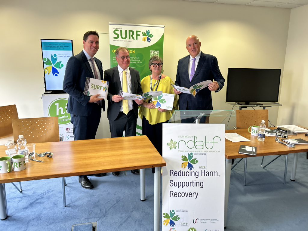 Minister Martin Heydon, Minister Colm Burke, SURF Coordinator Lisa Baggott and SURF Chairperson Aubrey McCarthy with the Strategic Plan.